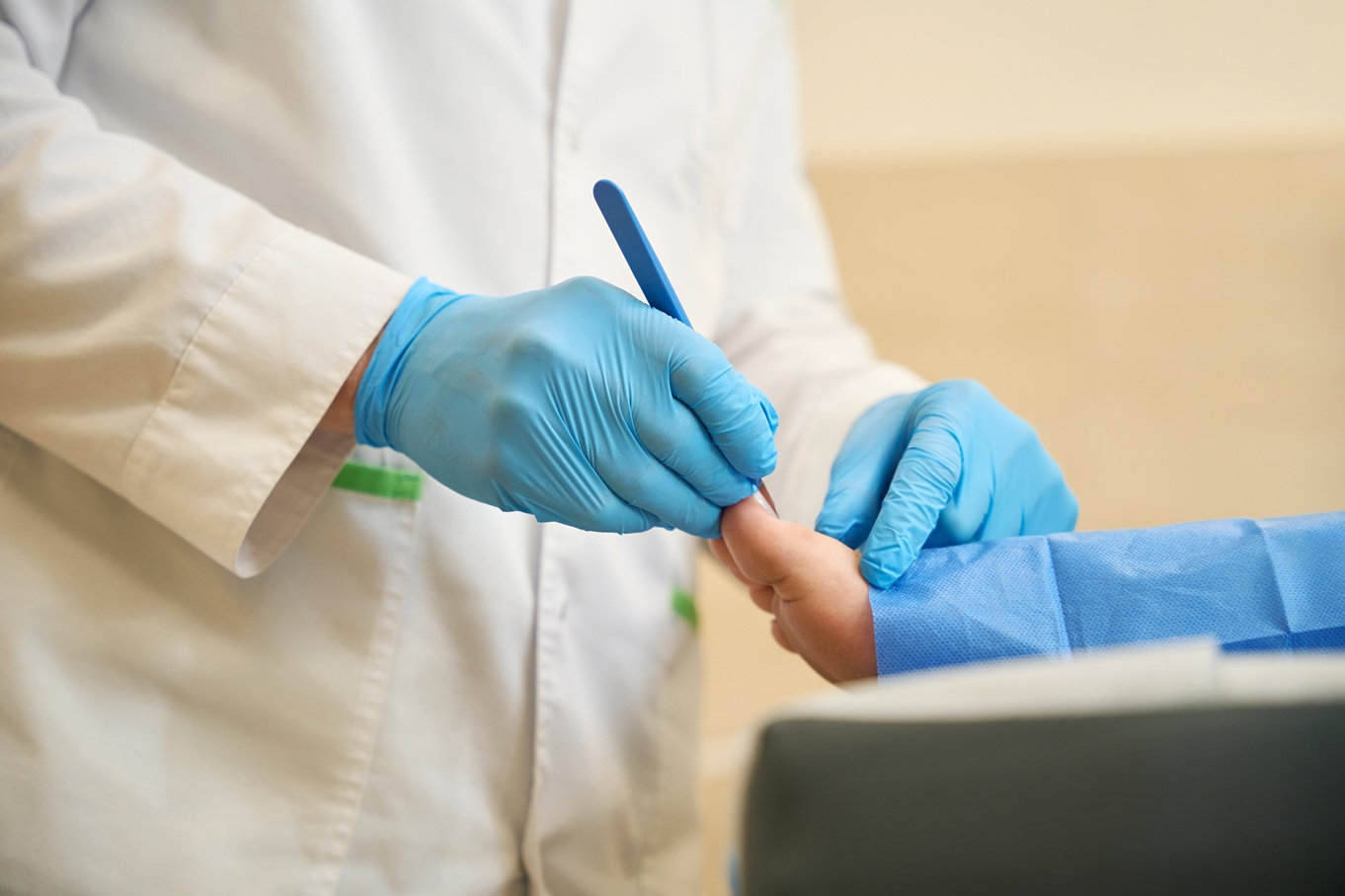 Podiatrist,Performing,Toenail,Surgery,On,Adult,Person Clinician performing nail surgery